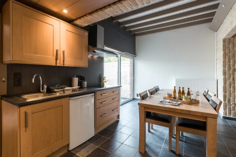 Kitchen with wooden cabinets and dining table