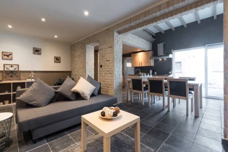 Spacious living area with brick arches in the Spacious Apartment